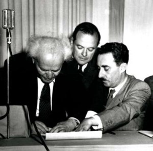 David Ben-Gurion signs the Declaration of Independence on May 14, 1948. Moshe Sharett is on the right
